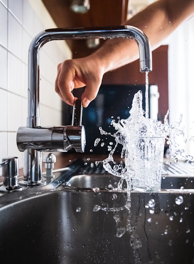 person opening faucet