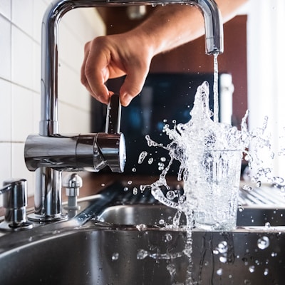 person opening faucet