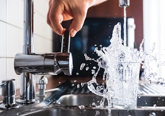 person opening faucet