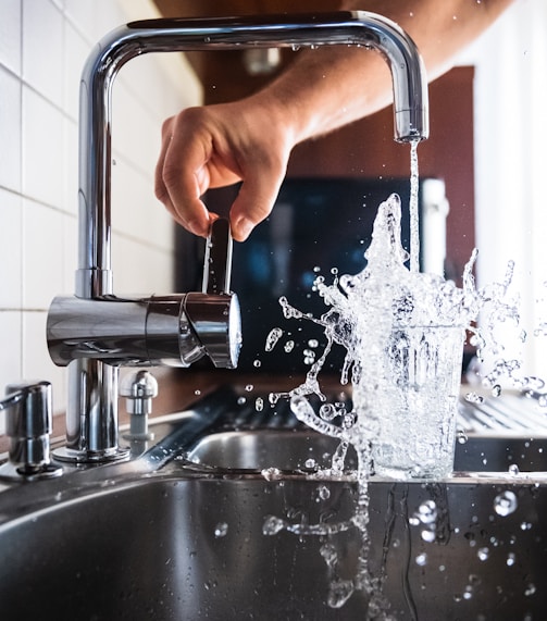 person opening faucet