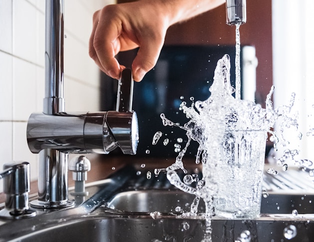 person opening faucet