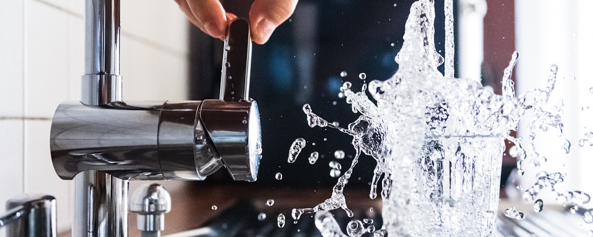 person opening faucet