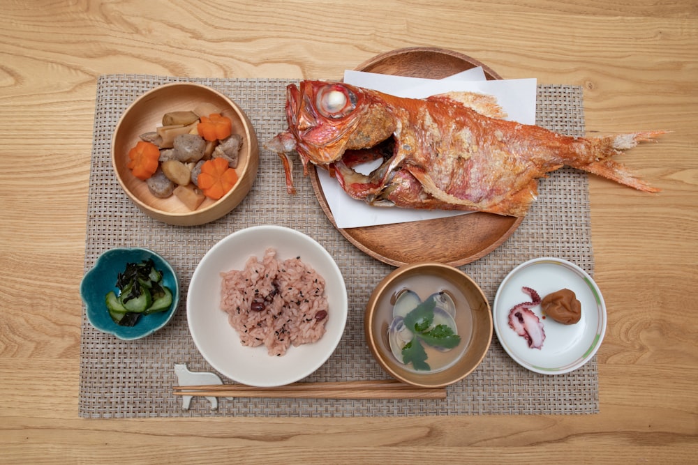 foods in round bowls on brown mat