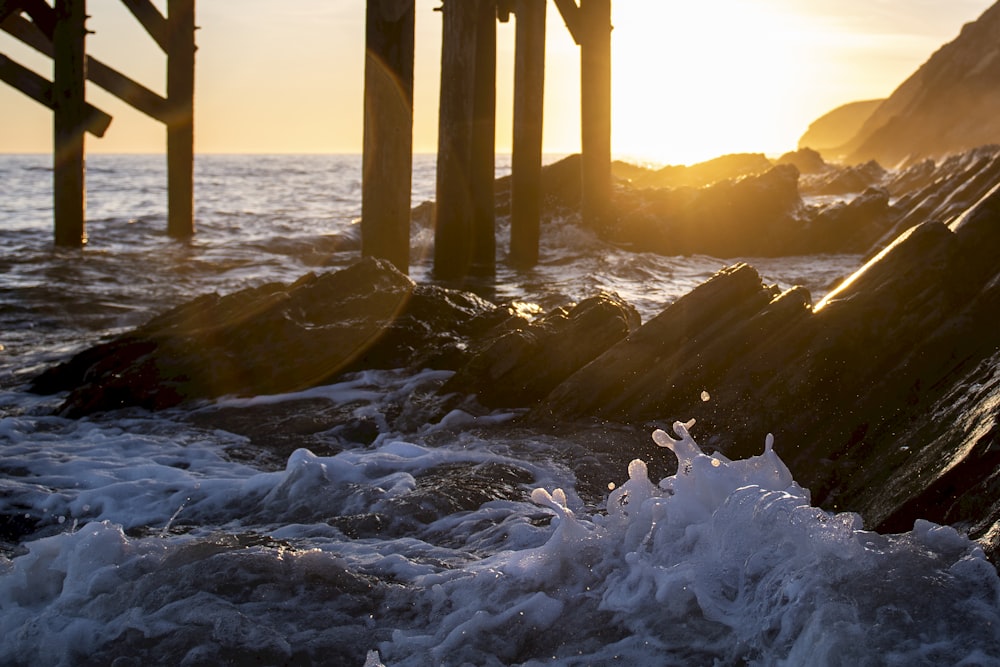 waves on shore during golden hour