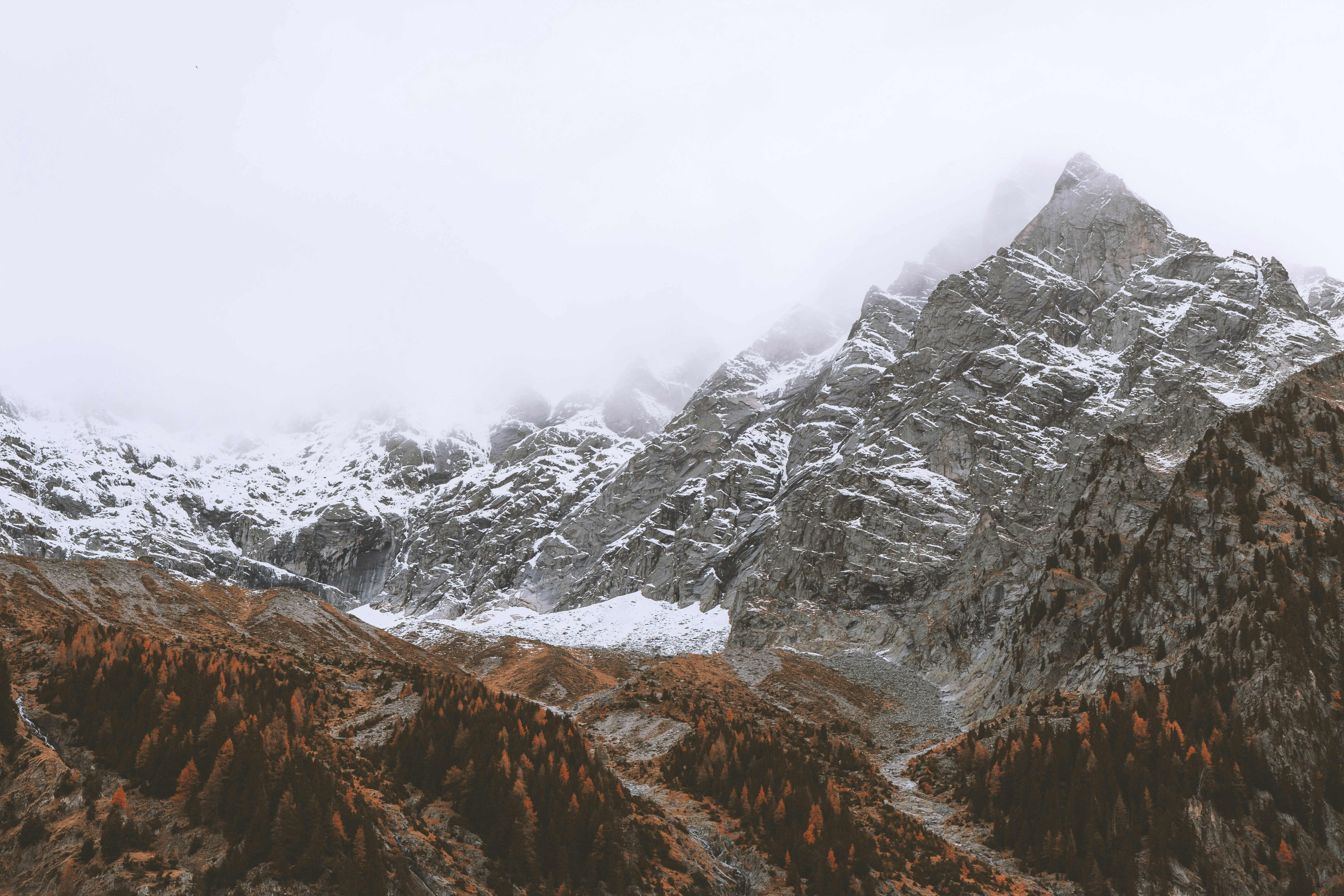 glacier mountain under white clouds