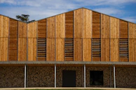 Commercial building facade featuring rich brown WPC panels blending wood warmth with modern design.