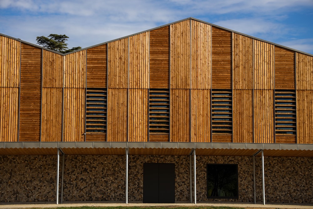 brown wooden building under cloudy sky