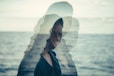 woman standing near body of water