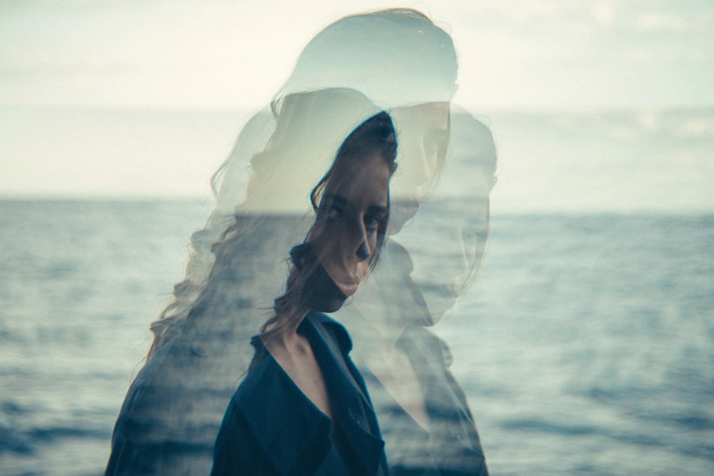 woman standing near body of water