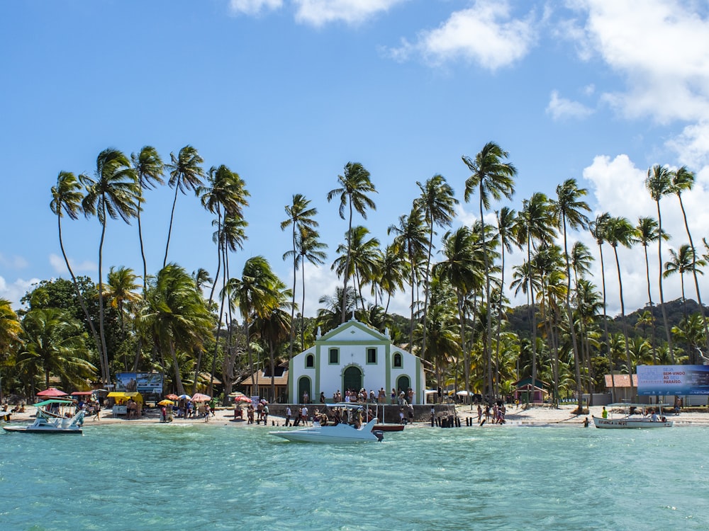 people in front of church near seashore during daytime