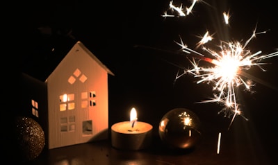 A cozy winter scene featuring illuminated outdoor decorations.