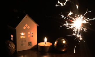 A cozy winter scene featuring illuminated outdoor decorations.