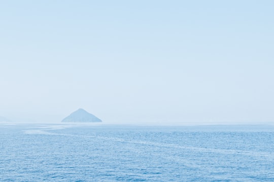 body of water overlooking island at daytime in Kagawa Prefecture Japan