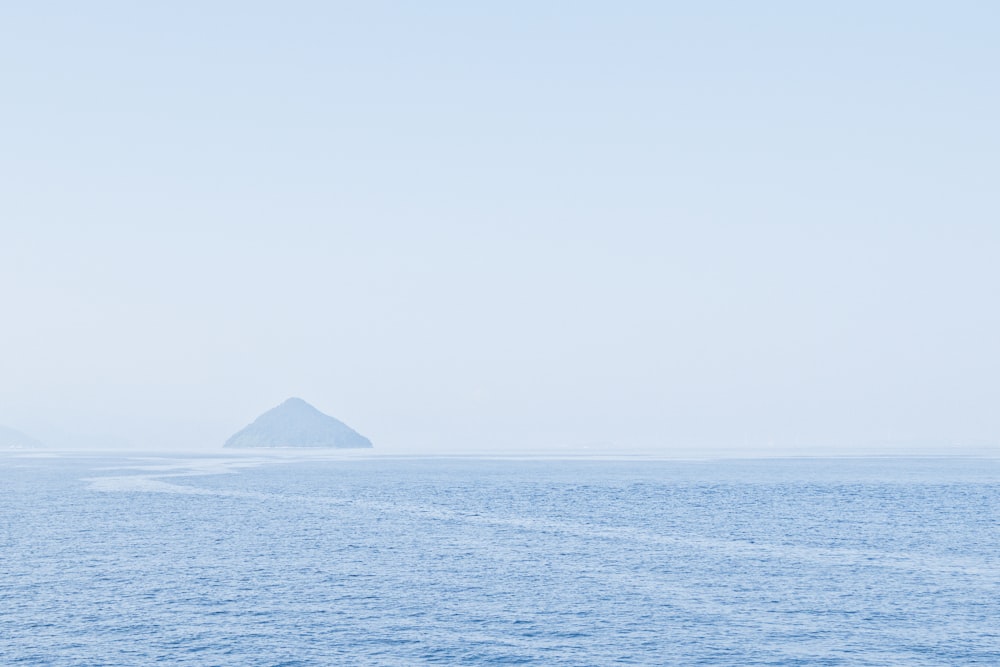 body of water overlooking island at daytime