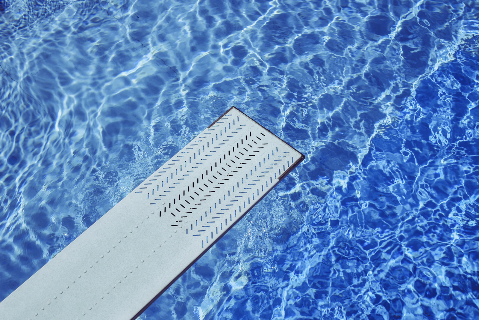 Pool being cleaned with a skimmer