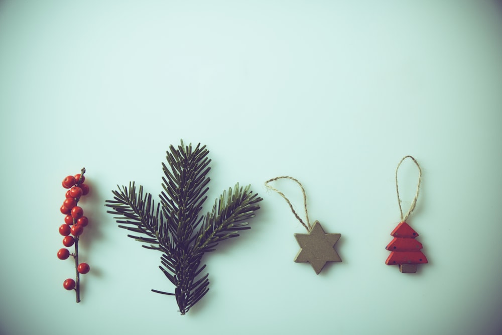 red mistletoe, green pine spruce, and two ornaments