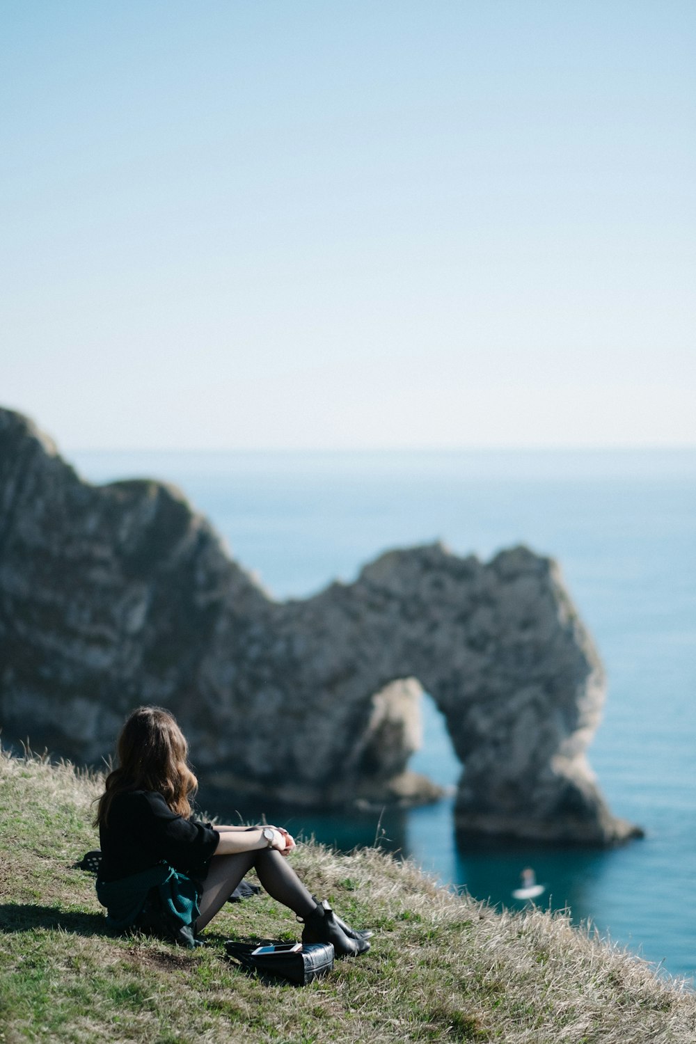 woman sitting on grass