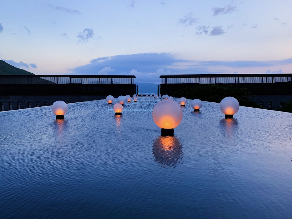 round LED lights on wet surface during daytime