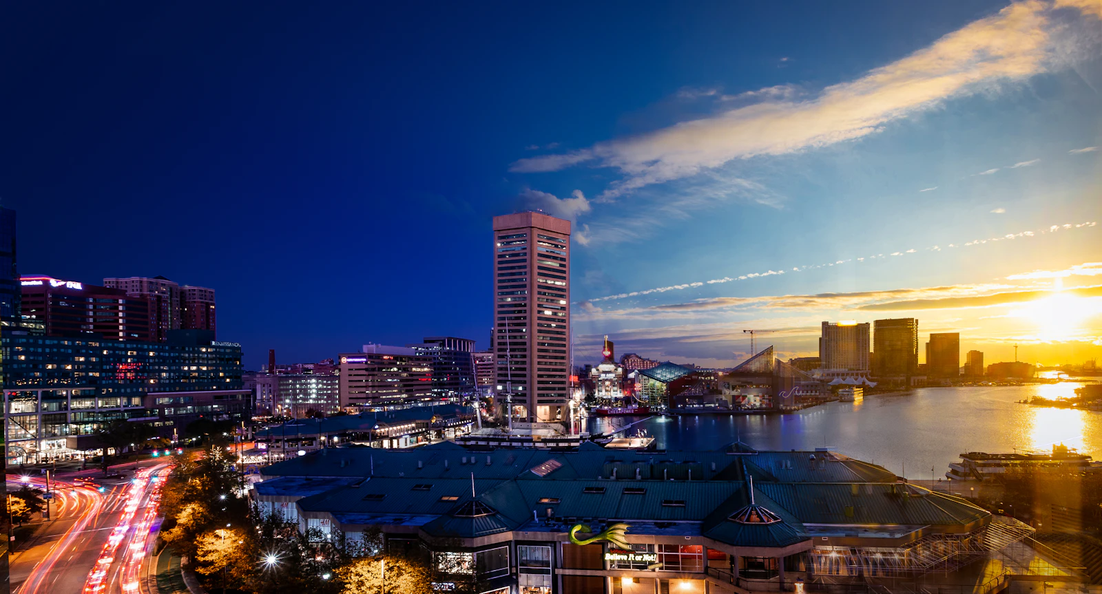 Baltimore Inner Harbor waterfront transitioning from day to night