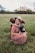 man and two children on grass field