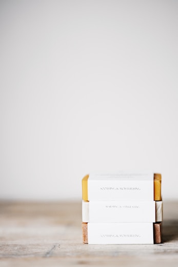 several stack of bar soap on white surface