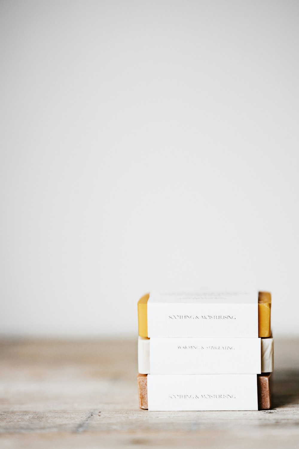 several stack of bar soap on white surface