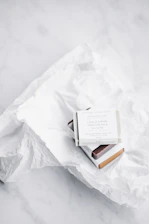 Close-up of a sleek, modern tissue box design featuring rich blue accents and crisp printing details.