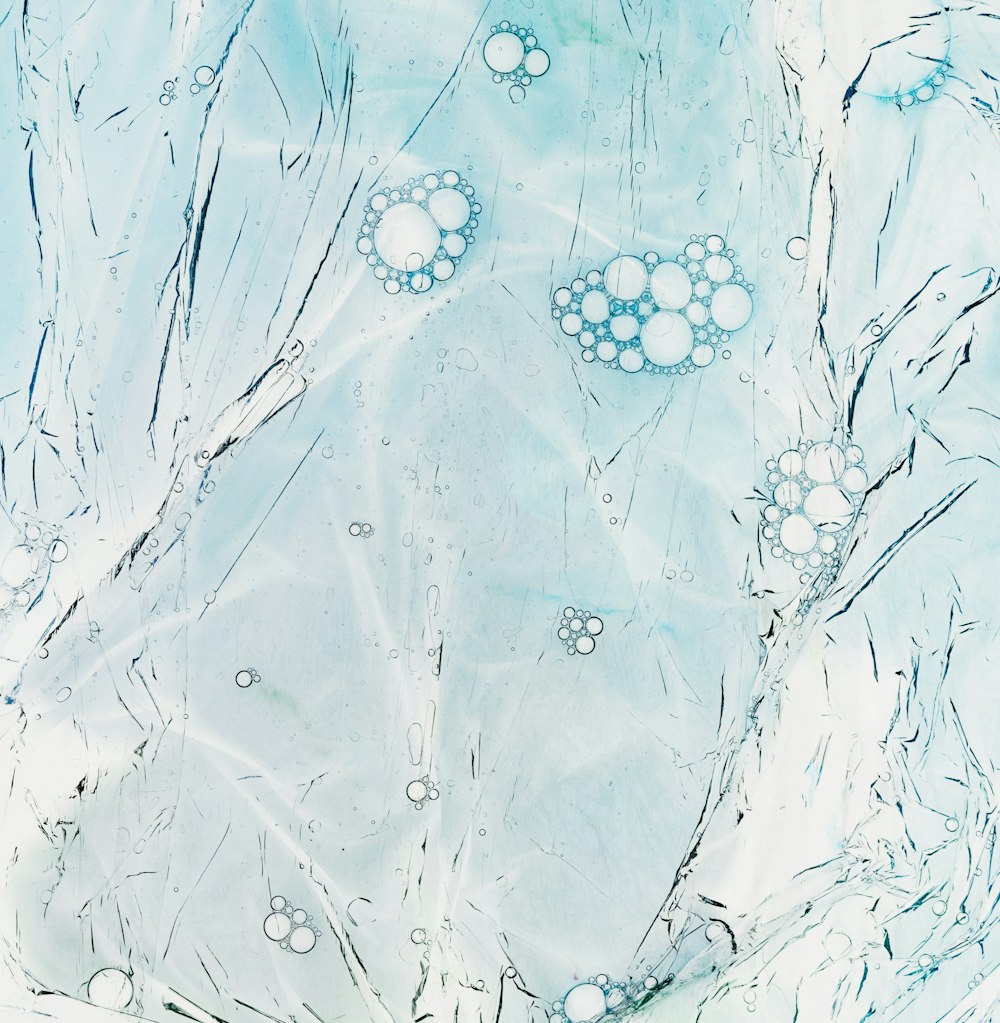 a painting of water and bubbles on a blue background