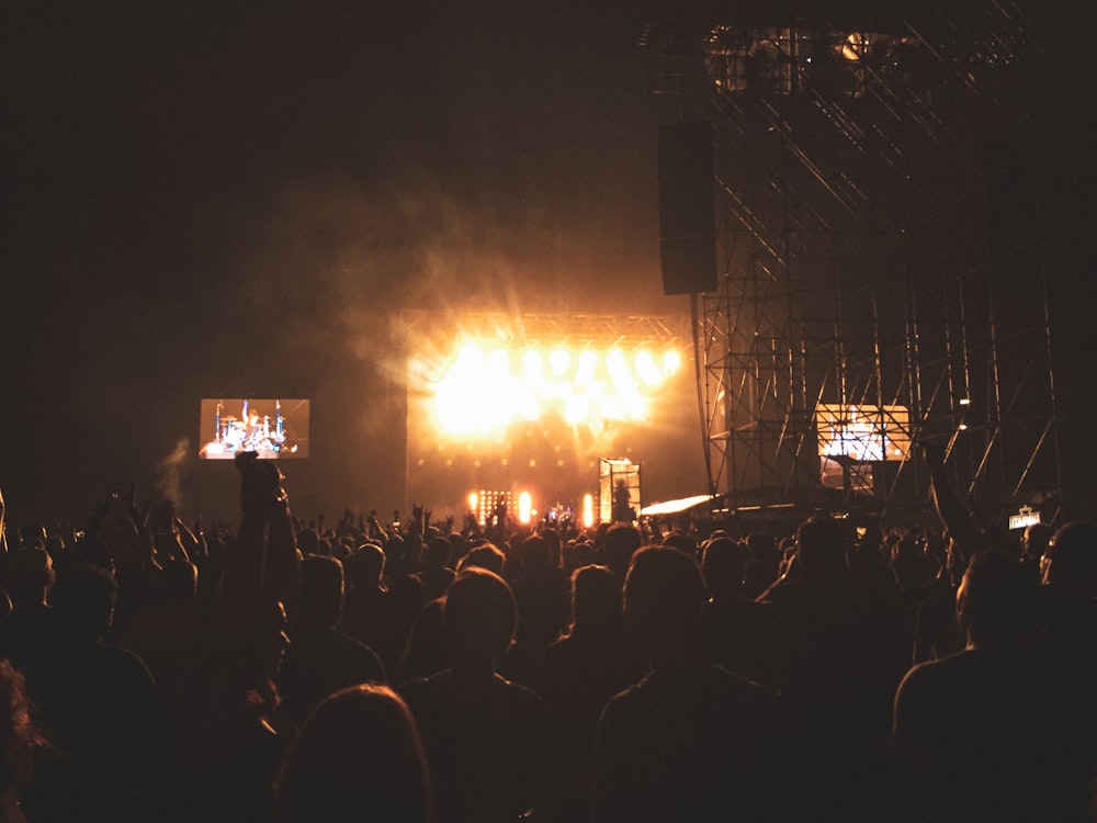 people watching stage during daytime