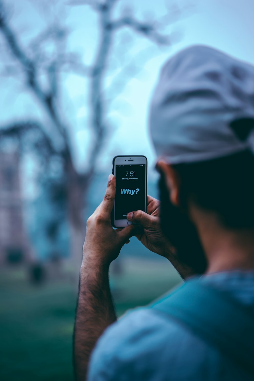 man using silver iPhone 6