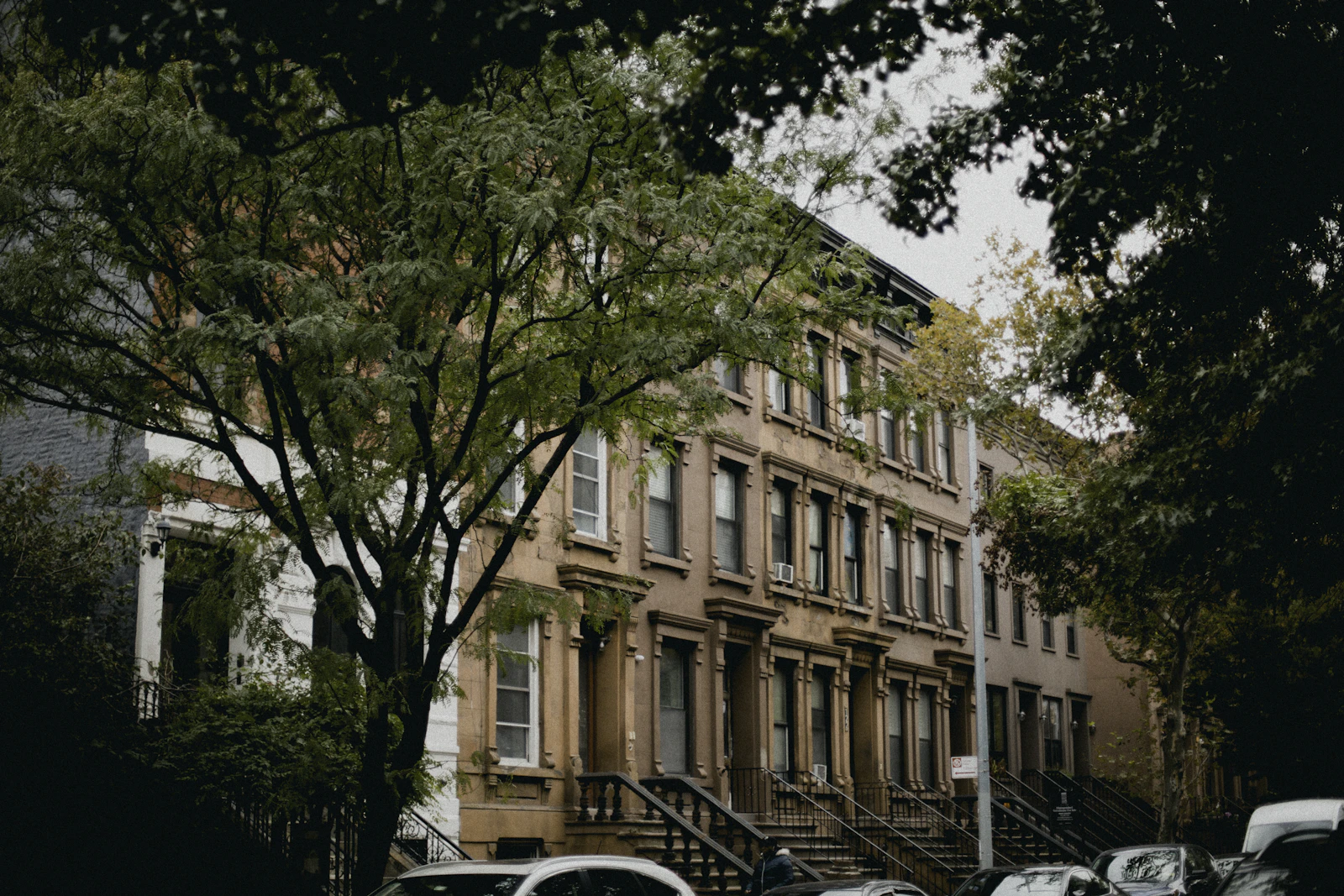 Brownstone cooperative buildings on a city street