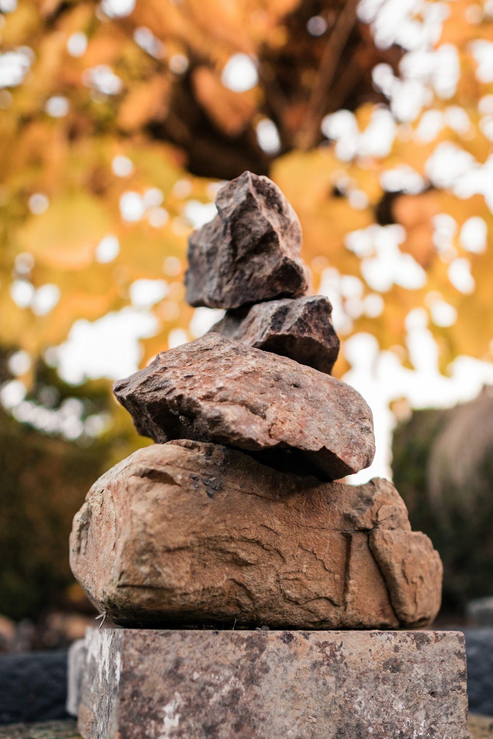 selective focus photography of stone cairn