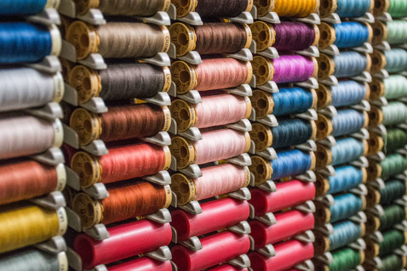 Assorted colours of sewing thread on spools