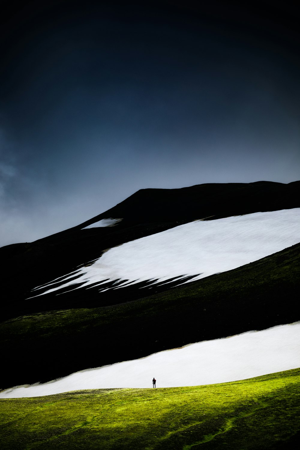 person standing near mountain