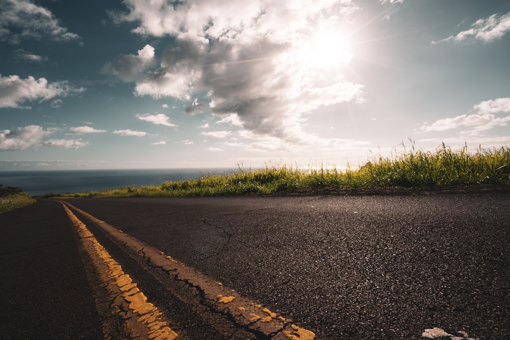 asphalt road under white sky