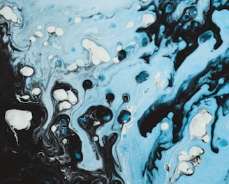 a blue and black abstract painting with bubbles