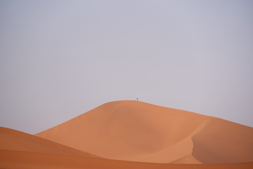 brown desert under cloudy sky