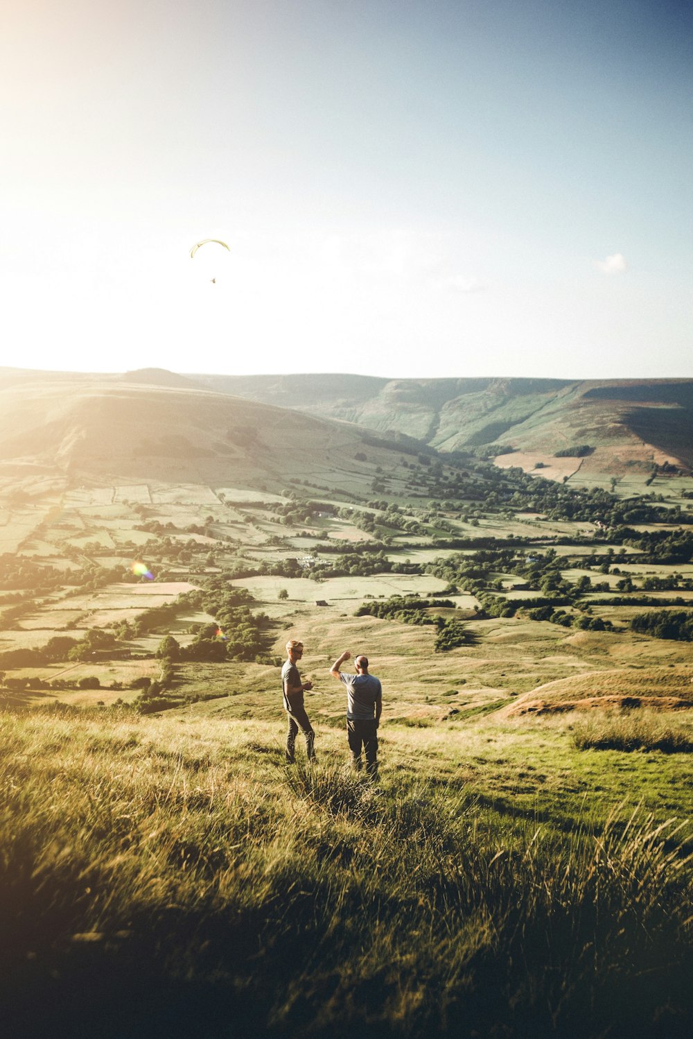 two person standing on grass during daytime