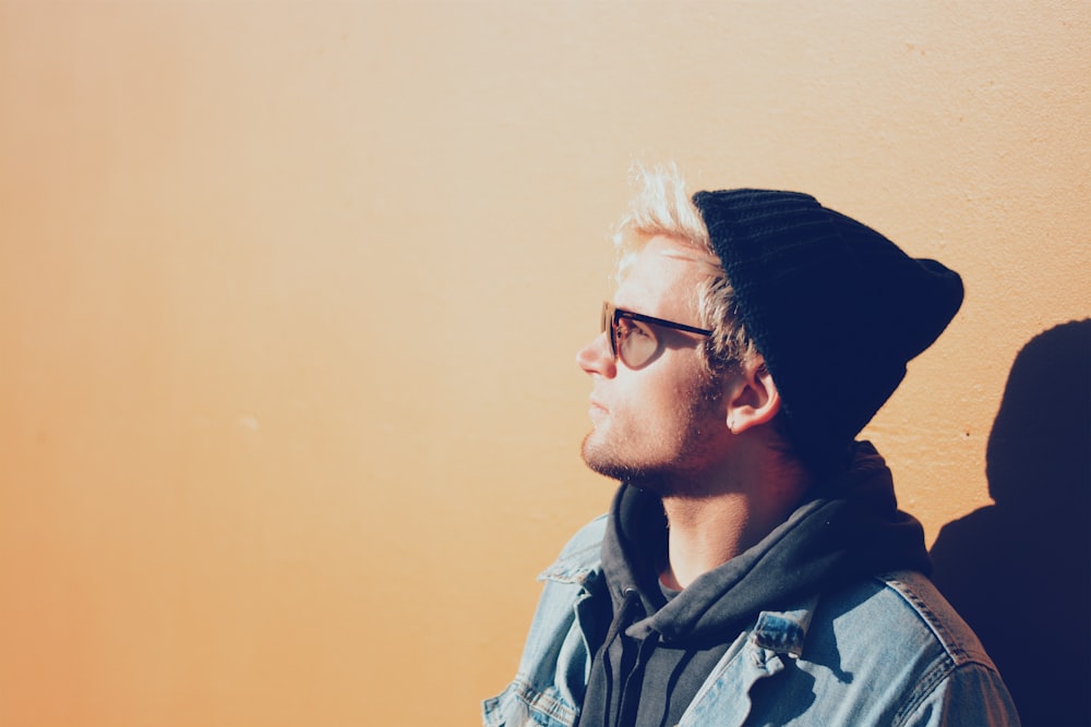 man wearing a black beanie and sunglasses