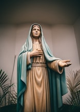 Mother Mary statue beside plants