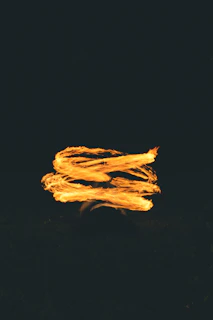 a blurry photo of a fire with a black background