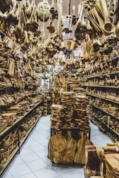 Various wooden artifacts displayed on shelves in a store.