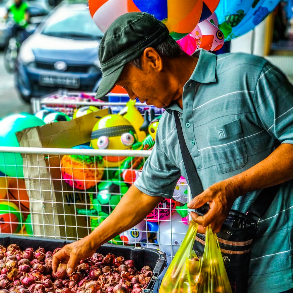 man picking bulb of onion