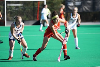 A vibrant image of a field hockey match in action.