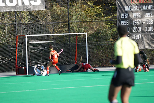 An intense game moment highlighting a flag pull, with focused faces and swift movement.