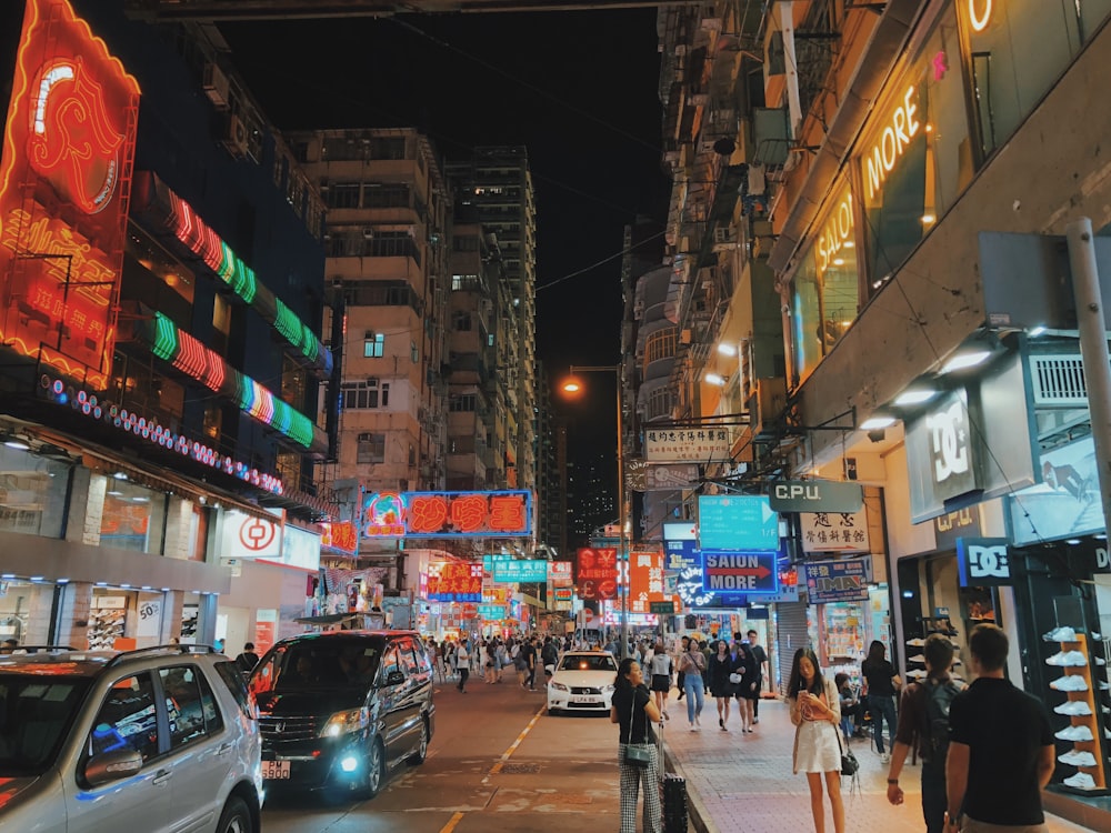 people walking between buildings