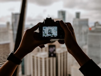 Camera taking pictures of buildings for photography services