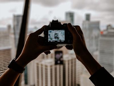 Camera taking pictures of buildings for photography services