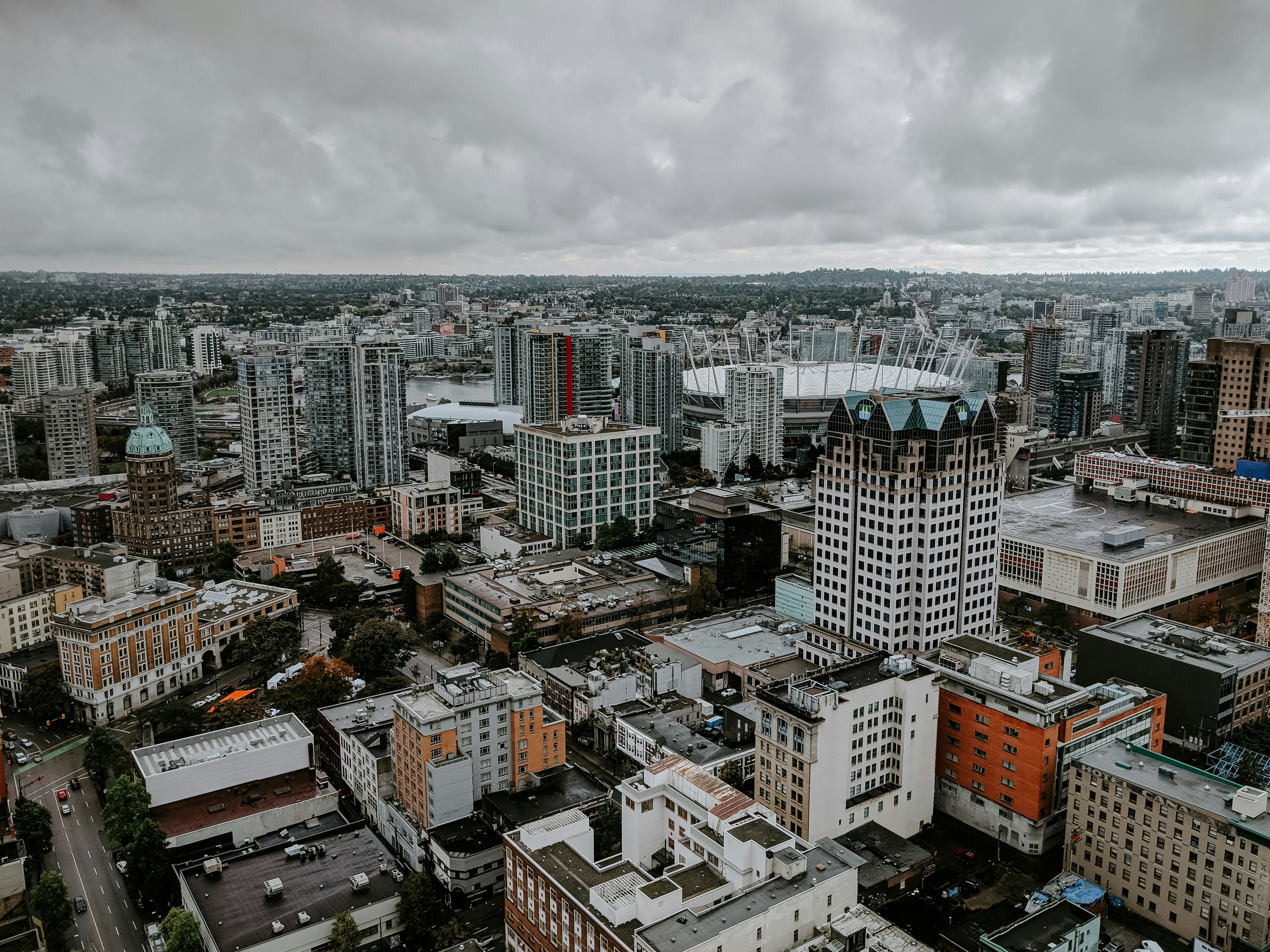 high-angle photography of buildings under grey sky