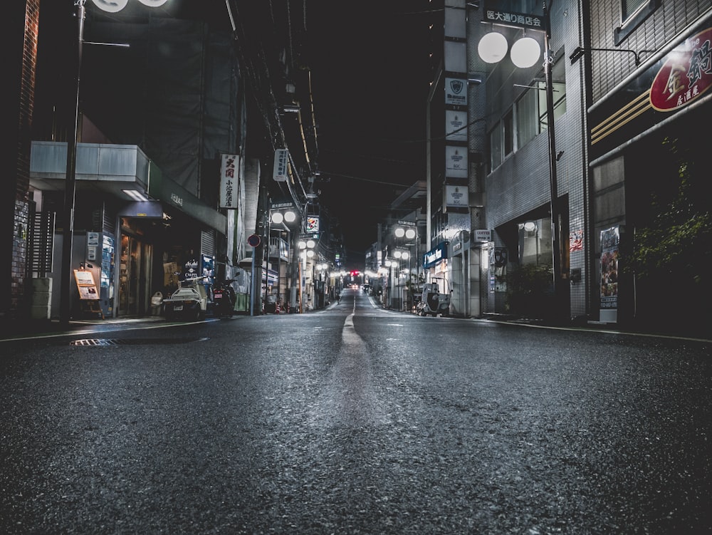 gray concrete road between buildings